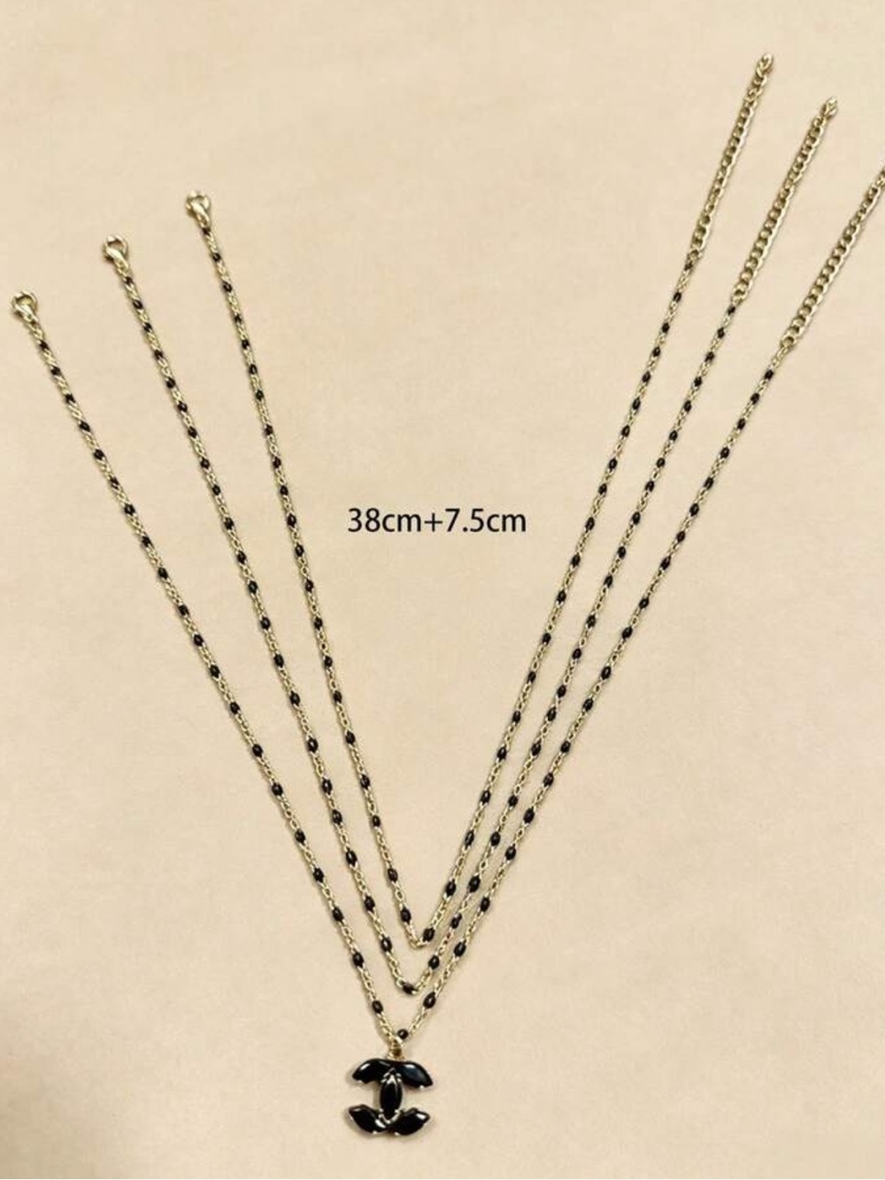 CC pendant on Gold and Black Beaded Set of 3 Layered Necklaces - Picture 3 of 3